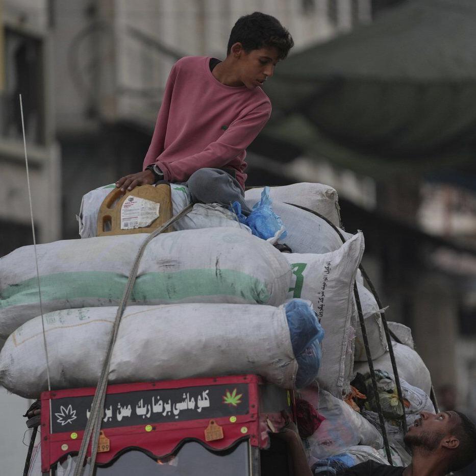 Photos show displaced Palestinians fleeing the northern Gaza Strip